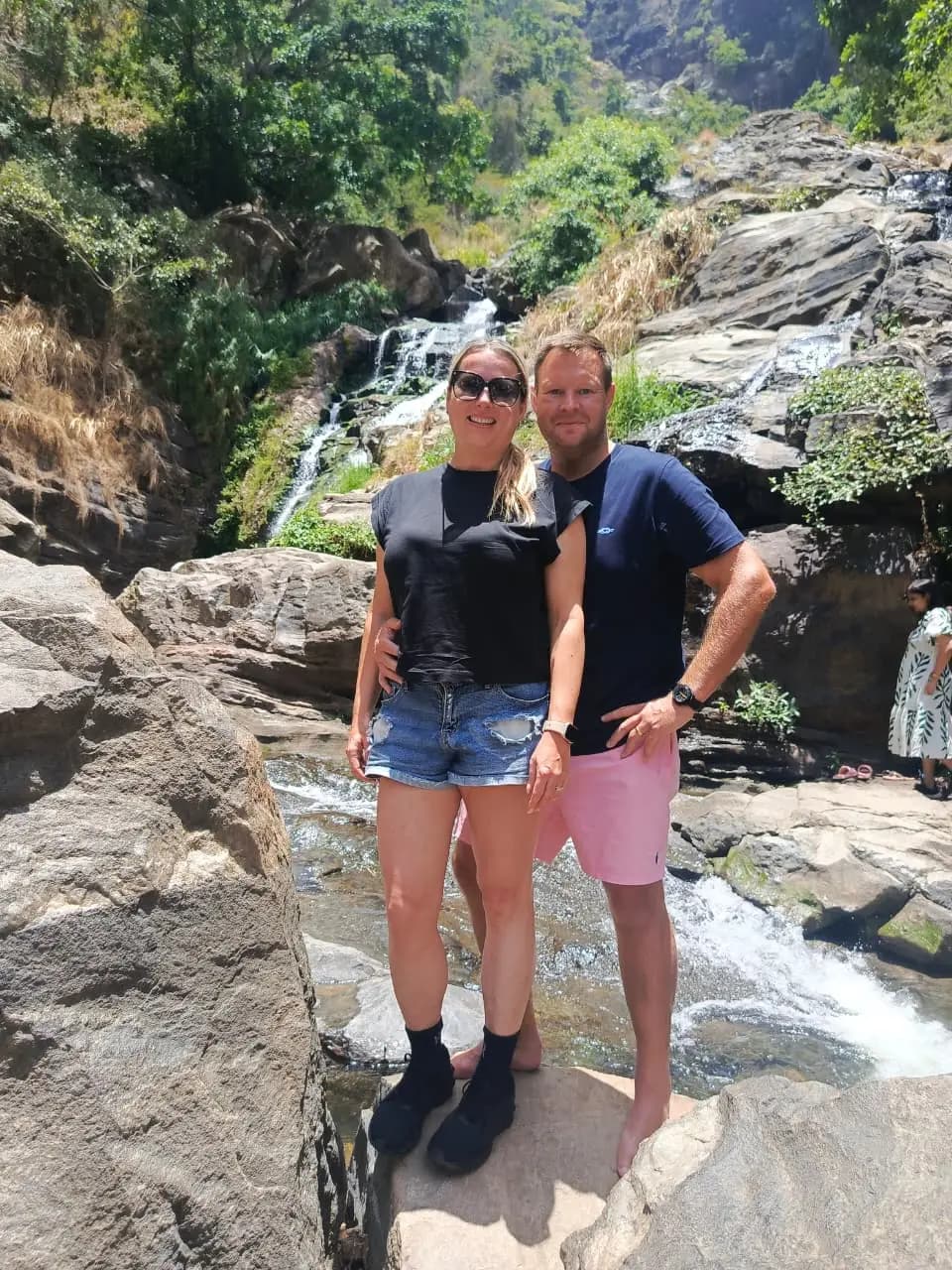 Couple enjoying a scenic stop at Ravana Falls in Ella during their private tour